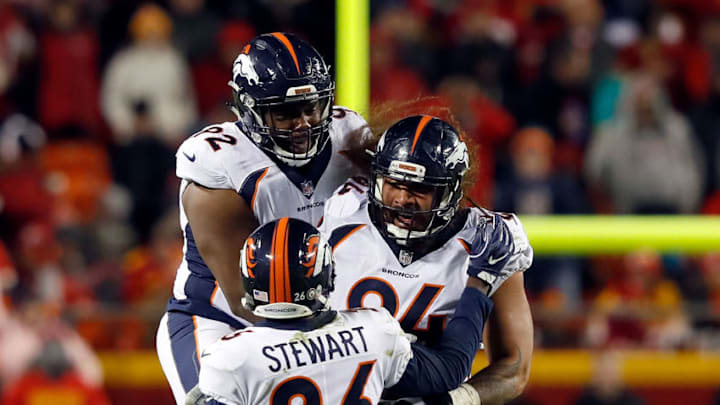 KANSAS CITY, MO - OCTOBER 30: Nose tackle Domata Peko #94 of the Denver Broncos celebrates with Zach Kerr #92 and free safety Darian Stewart #26 after recovering a fumble during the game against the Kansas City Chiefs at Arrowhead Stadium on October 30, 2017 in Kansas City, Missouri. (Photo by Jamie Squire/Getty Images)