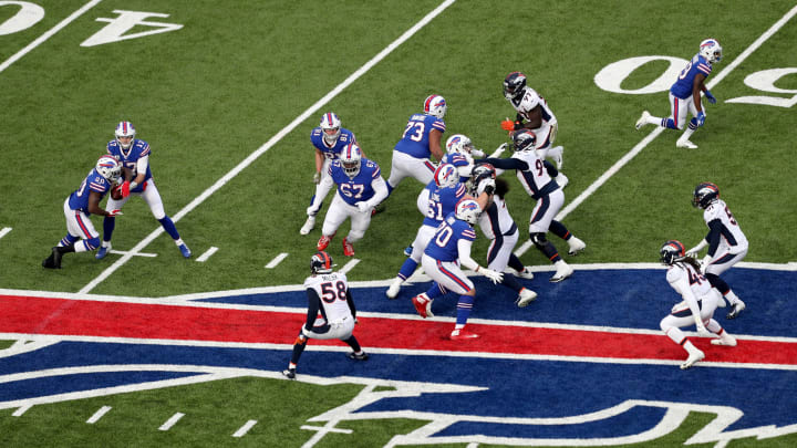 ORCHARD PARK, NEW YORK – NOVEMBER 24: Josh Allen #17 of the Buffalo Bills hands the ball to teammate Frank Gore #20 during the third quarter of an NFL game against the Denver Broncos at New Era Field on November 24, 2019 in Orchard Park, New York. Buffalo Bills defeated the Denver Broncos 20-3. (Photo by Bryan M. Bennett/Getty Images)