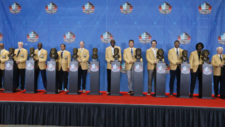 CANTON, OHIO - AUGUST 07: Members of the Pro Football Hall of Fame Centennial Class, (L-R) Donnie Shell, Cliff Harris, Isaac Bruce, Troy Polamalu, Bill Cowher, Harold Carmichael, Jimbo Covert, Steve Hutchinson, Steve Atwater, Edgerrin James, and Jimmy Johnson, pose during the induction ceremony at the Pro Football Hall of Fame on August 7, 2021 in Canton, Ohio. (Photo by Ron Schwane-Pool/Getty Images)