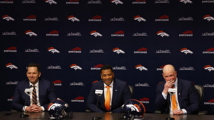 ENGLEWOOD, CO – MARCH 16: Quarterback Russell Wilson #3 of the Denver Broncos address the media as (L) General Manager George Paton of the Denver Broncos and Head Coach Nathaniel Hackett of the Denver Broncos look on at UCHealth Training Center on March 16, 2022 in Englewood, Colorado. (Photo by Justin Edmonds/Getty Images)