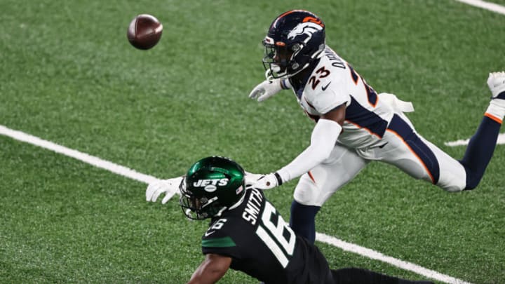 EAST RUTHERFORD, NEW JERSEY - OCTOBER 01: Michael Ojemudia #23 of the Denver Broncos is called for pass interference during the third quarter against Jeff Smith #16 of the New York Jets at MetLife Stadium on October 01, 2020 in East Rutherford, New Jersey. (Photo by Elsa/Getty Images)