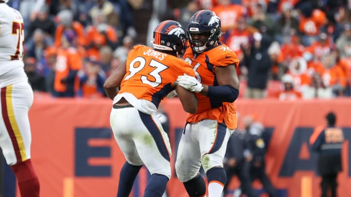 DENVER, CO – OCTOBER 31: Shelby Harris #96 and Dre’Mont Jones #93 of the Denver Broncos react to a missed field goal during the fourth quarter of the game against the Denver Broncos at Empower Field At Mile High on October 31, 2021 in Denver, Colorado. (Photo by Justin Tafoya/Getty Images)