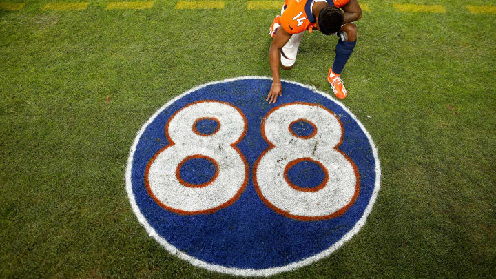 DENVER, COLORADO – DECEMBER 12: Courtland Sutton #14 of the Denver Broncos kneels and takes a moment in front of the #88 tribute logo to the late former Denver Broncos player Demaryius Thomas after the game against the Detroit Lions at Empower Field At Mile High on December 12, 2021 in Denver, Colorado. (Photo by Justin Edmonds/Getty Images)