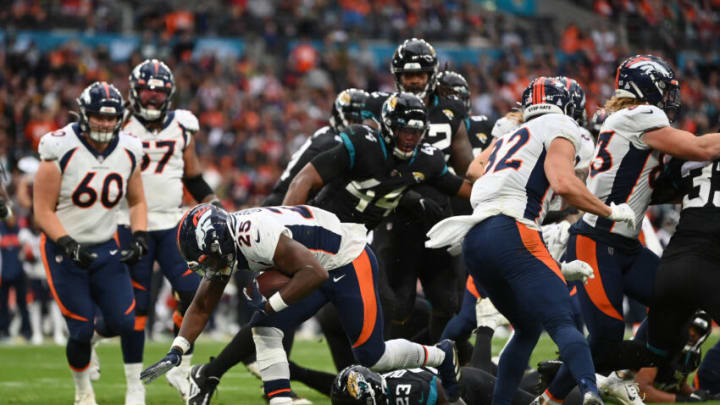 LONDON, ENGLAND - OCTOBER 30: Melvin Gordon III #25 of the Denver Broncos runs in to score a touchdown during the third quarter in the NFL match between Denver Broncos and Jacksonville Jaguars at Wembley Stadium on October 30, 2022 in London, England. (Photo by Dan Mullan/Getty Images)