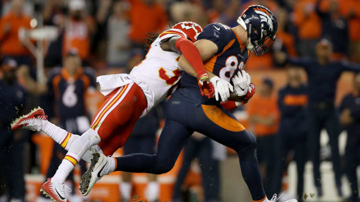 DENVER, CO – OCTOBER 01: Jeff Heuerman #82 of the Denver Broncos stiff is brought down after making a reception by Ron Parker #38 of the Kansas City Chiefs at Broncos Stadium at Mile High on October 1, 2018 in Denver, Colorado. (Photo by Matthew Stockman/Getty Images)