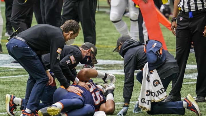 Nov 8, 2020; Atlanta, Georgia, USA; Denver Broncos tight end Albert Okwuegbunam (85) is assisted after being injured against the Atlanta Falcons during the second half at Mercedes-Benz Stadium. Mandatory Credit: Dale Zanine-USA TODAY Sports