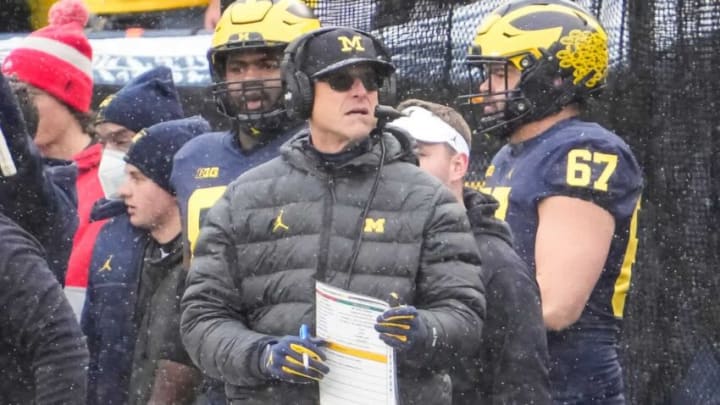 Denver Broncos - Michigan Wolverines head coach Jim Harbaugh stands on the sideline during the NCAA football game at Michigan Stadium in Ann Arbor on Monday, Nov. 29, 2021.Ohio State Buckeyes At Michigan Wolverines