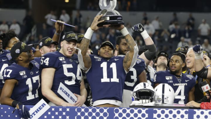 Dec 28, 2019; Arlington, Texas, USA; Penn State Nittany Lions linebacker Micah Parsons (11) holds up the most outstanding defensive player award after the game against the Memphis Tigers at AT&T Stadium. Mandatory Credit: Tim Heitman-USA TODAY Sports