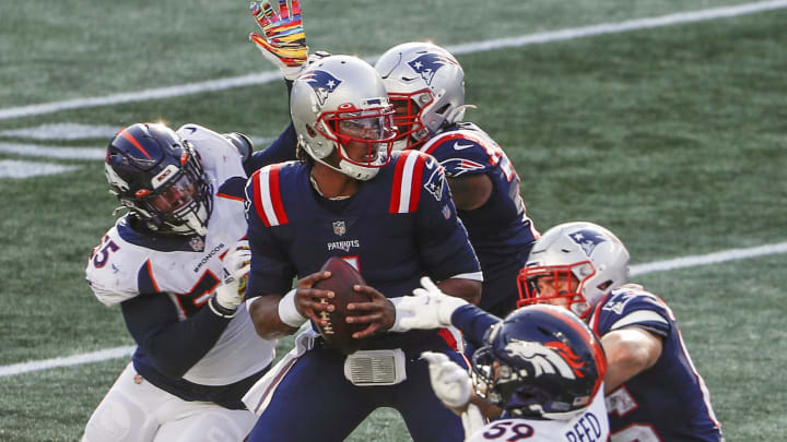 Oct 18, 2020; Foxborough, Massachusetts, USA; New England Patriots quarterback Cam Newton (1) drops back to pass under pressure from Denver Broncos linebacker Bradley Chubb (55) and linebacker Malik Reed (59) during the second half at Gillette Stadium. Mandatory Credit: Winslow Townson-USA TODAY Sports