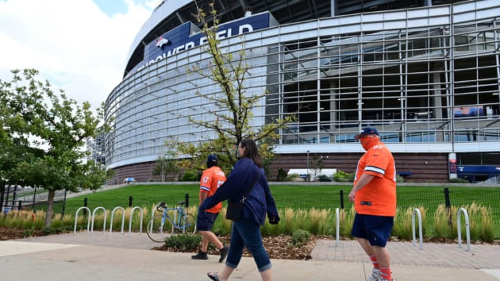Sep 27, 2020; Denver, Colorado, USA; Denver Broncos fans walk outside of Empower Field at Mile High before the game against the Tampa Bay Buccaneers. Mandatory Credit: Ron Chenoy-USA TODAY Sports