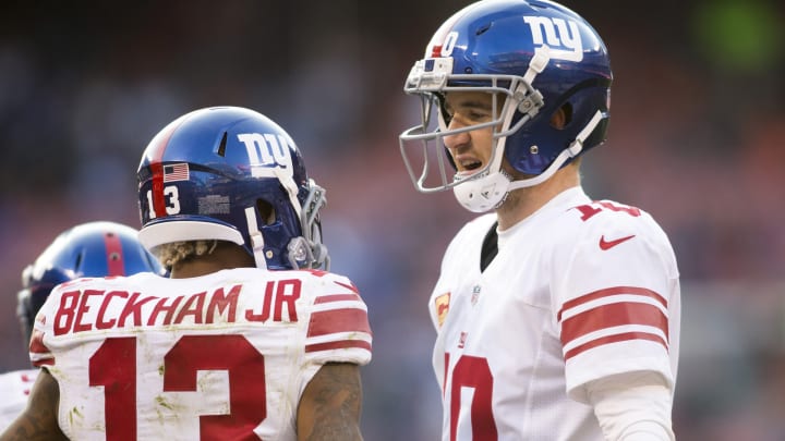 Nov 27, 2016; Cleveland, OH, USA; New York Giants quarterback Eli Manning (10) congratulates wide receiver Odell Beckham Jr. (13) on his touchdown reception during the fourth quarter against the Cleveland Browns at FirstEnergy Stadium. The Giants won 27-13. Mandatory Credit: Scott R. Galvin-USA TODAY Sports