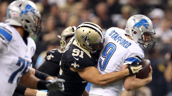 Dec 21, 2015; New Orleans, LA, USA; Detroit Lions quarterback Matthew Stafford (9) is sacked by New Orleans Saints outside linebacker Kasim Edebali (91) in the first quarter of the game at the Mercedes-Benz Superdome. Mandatory Credit: Chuck Cook-USA TODAY Sports