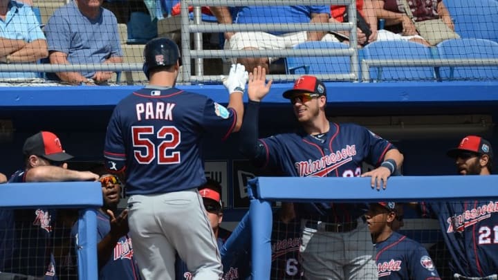 Mar 8, 2016; Dunedin, FL, USA; Minnesota Twins infielder Byung Ho Park (52) is greeted by his teammates after hitting a solo home run in the second inning of the spring training game against the Toronto Blue Jays at Florida Auto Exchange Park. Mandatory Credit: Jonathan Dyer-USA TODAY Sports