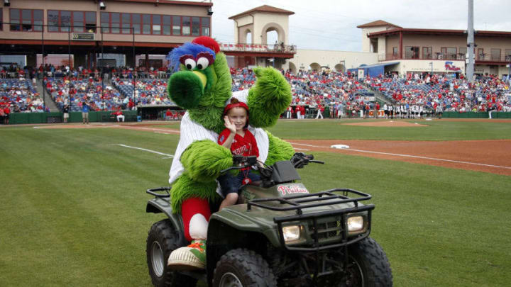 CLEARWATER, FL - MARCH 12: The Phillie Phanatic rides a young fan around on a 4 wheeler before a spring training game between the Philadelphia Phillies and the Boston Red Sox at Spectrum Field on March 12, 2017 in Clearwater, Florida. (Photo by Justin K. Aller/Getty Images)
