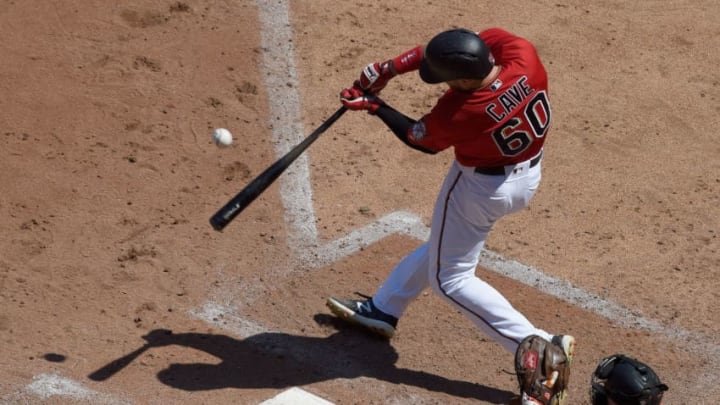 MINNEAPOLIS, MN - JULY 8: Jake Cave #60 of the Minnesota Twins hits an RBI single as Caleb Joseph #36 of the Baltimore Orioles catches during the sixth inning of the game on July 8, 2018 at Target Field in Minneapolis, Minnesota. (Photo by Hannah Foslien/Getty Images)