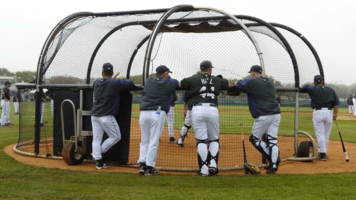 Tampa Bay Devil Rays surround the battling cage during a pitching drill at Raymond A. Naimoli baseball complex in St. Petersburg, Florida on February 23, 2006. (Photo by A. Messerschmidt/Getty Images) *** Local Caption ***