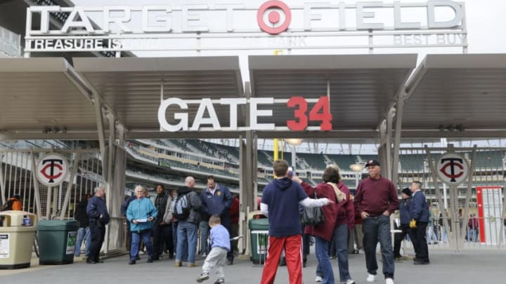 MINNEAPOLIS, MN - MARCH 27: Fans enter through gate 34 before an exhibition game between the Minnesota Golden Gophers and the Louisiana Tech Bulldogs at Target Field on March 27, 2010 in Minneapolis, Minnesota. The gates at Target Field are numbered after Minnesota Twins retired jerseys. (Photo by Hannah Foslien /Getty Images)