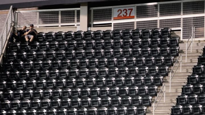 MINNEAPOLIS, MN - SEPTEMBER 11: Fans watch from the last row of the outfield seats during the ninth inning of the game between the Minnesota Twins and the Oakland Athletics on September 11, 2013 at Target Field in Minneapolis, Minnesota. The Athletics defeated the Twins 18-3. (Photo by Hannah Foslien/Getty Images)