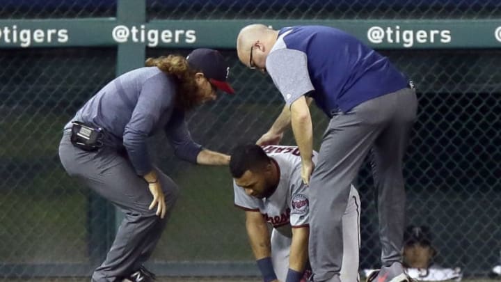 DETROIT, MI - SEPTEMBER 17: Eddie Rosario #20 of the Minnesota Twins is assisted by trainers after injuring his lower right leg while fielding a ball hit by Jim Adduci of the Detroit Tigers during the fourth inning at Comerica Park on September 17, 2018 in Detroit, Michigan. (Photo by Duane Burleson/Getty Images)