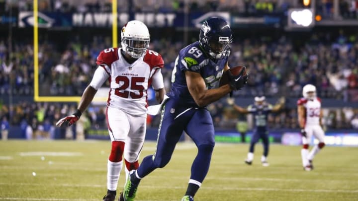 Nov 15, 2015; Seattle, WA, USA; Seattle Seahawks wide receiver Doug Baldwin (89) catches a touchdown against Arizona Cardinals cornerback Jerraud Powers (25) during the third quarter at CenturyLink Field. Mandatory Credit: Joe Nicholson-USA TODAY Sports