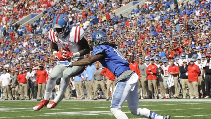 Oct 17, 2015; Memphis, TN, USA; Mississippi Rebels wide receiver Laquon Treadwell (1) catches a touchdown pass against Memphis Tigers defensive back Dontrell Nelson (10) during the game at Liberty Bowl Memorial Stadium. Memphis Tigers beat Mississippi Rebels 37-24. Mandatory Credit: Justin Ford-USA TODAY Sports