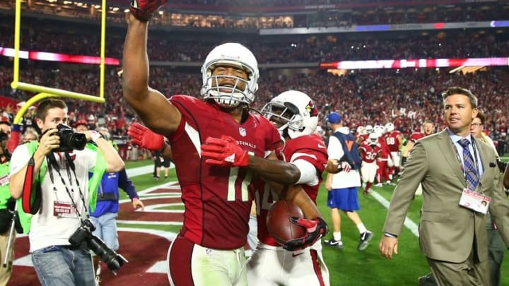 Jan 16, 2016; Glendale, AZ, USA; Arizona Cardinals wide receiver Larry Fitzgerald (11) celebrates with teammates after scoring the winning touchdown against the Green Bay Packers during overtime in a NFC Divisional round playoff game at University of Phoenix Stadium. Mandatory Credit: Mark J. Rebilas-USA TODAY Sports