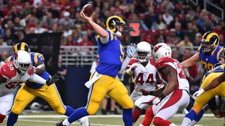Dec 6, 2015; St. Louis, MO, USA; St. Louis Rams quarterback Nick Foles (5) attempts a pass under pressure against the Arizona Cardinals the first half at the Edward Jones Dome. Mandatory Credit: Jasen Vinlove-USA TODAY Sports