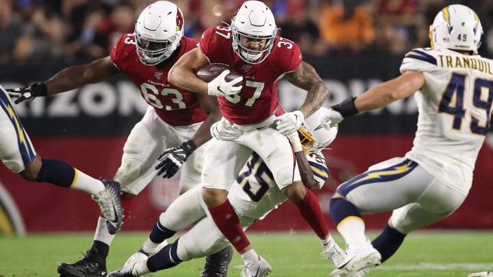 GLENDALE, ARIZONA – AUGUST 08: Running back D.J. Foster #37 of the Arizona Cardinals rushes the football against defensive back Adarius Pickett #35 of the Los Angeles Chargers during the NFL preseason game at State Farm Stadium on August 08, 2019 in Glendale, Arizona. The Cardinals defeated the Chargers 17-13. (Photo by Christian Petersen/Getty Images)
