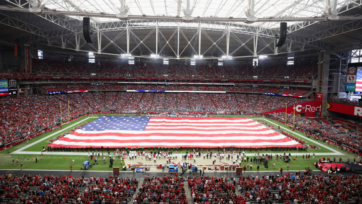 GLENDALE, ARIZONA – SEPTEMBER 08: The United States flag is held on the field for the national anthem before the NFL game between the Arizona Cardinals and the Detroit Lions at State Farm Stadium on September 08, 2019 in Glendale, Arizona. The Lions and Cardinals tied 27-27. (Photo by Christian Petersen/Getty Images)