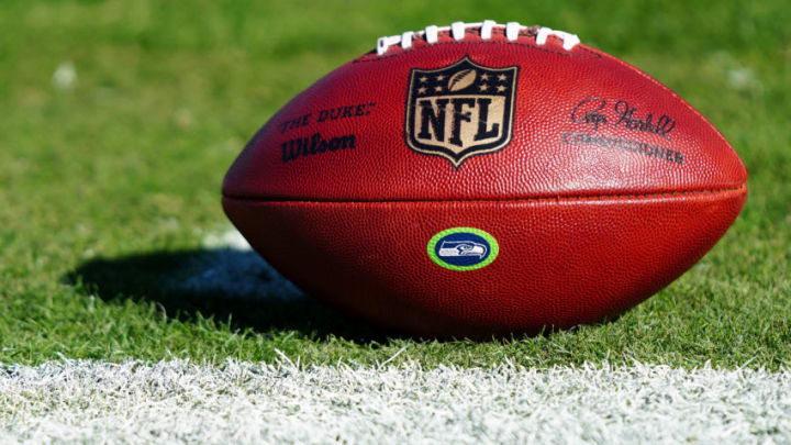 CHARLOTTE, NORTH CAROLINA - DECEMBER 15: A football with the NFL logo and the Seattle Seahawks logo before their game against the Carolina Panthers at Bank of America Stadium on December 15, 2019 in Charlotte, North Carolina. (Photo by Jacob Kupferman/Getty Images)
