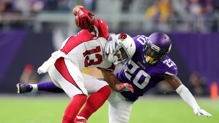 MINNEAPOLIS, MN – OCTOBER 14: Christian Kirk #13 of the Arizona Cardinals is tackled with the ball by Mackensie Alexander #20 of the Minnesota Vikings in the fourth quarter of the game at U.S. Bank Stadium on October 14, 2018 in Minneapolis, Minnesota. (Photo by Adam Bettcher/Getty Images)