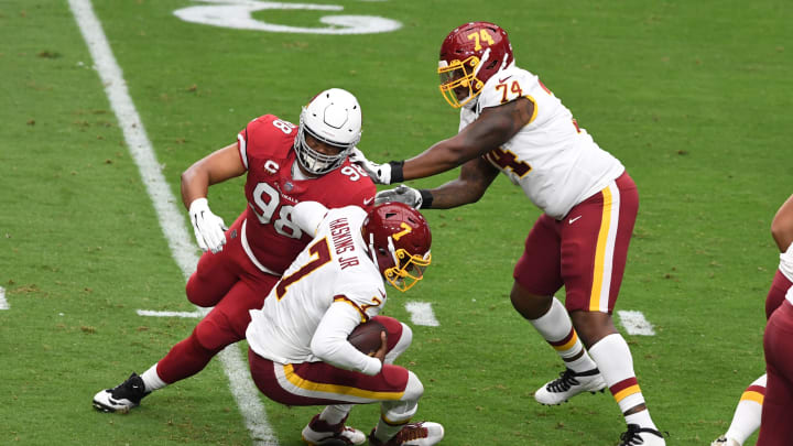 GLENDALE, ARIZONA – SEPTEMBER 20: Corey Peters #98 of the Arizona Cardinals rushes around the block of Geron Christian Sr #74 of the Washington Football Team to get a sack on Dwayne Haskins Jr #7 at State Farm Stadium on September 20, 2020 in Glendale, Arizona. (Photo by Norm Hall/Getty Images)