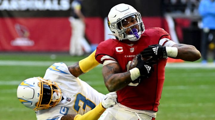 GLENDALE, ARIZONA - NOVEMBER 27: James Conner #6 of the Arizona Cardinals breaks tackle from Derwin James Jr. #3 of the Los Angeles Chargers in the fourth quarter at State Farm Stadium on November 27, 2022 in Glendale, Arizona. (Photo by Norm Hall/Getty Images) GLENDALE, ARIZONA - NOVEMBER 27: James Conner #6 of the Arizona Cardinals breaks tackle from Derwin James Jr. #3 of the Los Angeles Chargers in the fourth quarter at State Farm Stadium on November 27, 2022 in Glendale, Arizona. (Photo by Norm Hall/Getty Images)