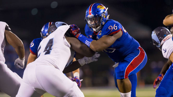 LAWRENCE, KS – SEPTEMBER 03: Daniel Wise #96 of the Kansas Jayhawks defends against Raess Johnson #54 of the Rhode Island Rams in the second half on September 3, 2016 at Memorial Stadium in Lawrence, Kansas. (Photo by Kyle Rivas/Getty Images) Raess Johnson ; Daniel Wise