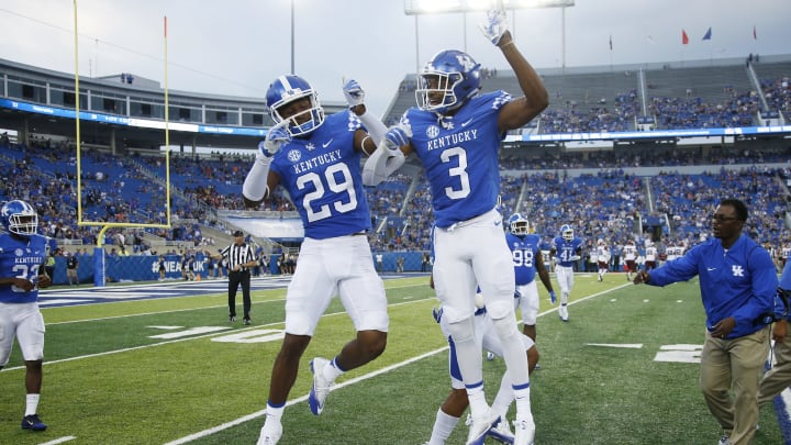 LEXINGTON, KY – SEPTEMBER 17: Derrick Baity #29 of the Kentucky Wildcats celebrates with Jordan Griffin #3 after intercepting a pass in the end zone against the New Mexico State Aggies in the second half at Commonwealth Stadium on September 17, 2016 in Lexington, Kentucky. Kentucky defeated New Mexico State 62-42. (Photo by Joe Robbins/Getty Images)