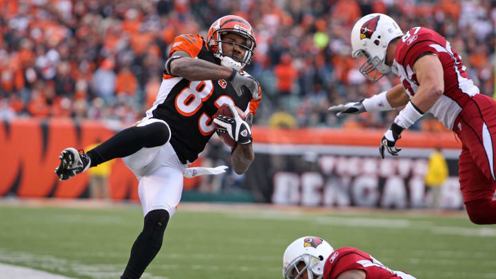 CINCINNATI – NOVEMBER 18: Antonio Chapman #83 of the Cincinnati Bengals is pushed out of bounds by Sean Morey #87 and Marcel Shipp #31 of the Arizona Cardinals at Paul Brown Stadium November 18, 2007 in Cincinnati, Ohio. (Photo by Andy Lyons/Getty Images)