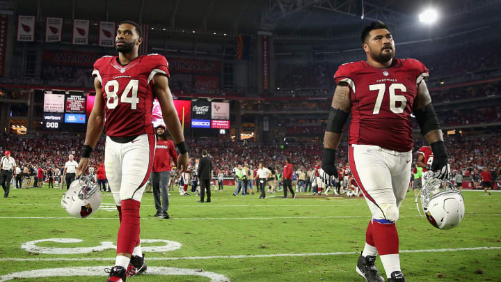 GLENDALE, AZ – SEPTEMBER 11: Tight end Jermaine Gresham #84 and guard Mike Iupati #76 of the Arizona Cardinals walk off the field following the NFL game against the New England Patriots at the University of Phoenix Stadium on September 11, 2016 in Glendale, Arizona. The Patriots defeated the Cardinals 23-21. (Photo by Christian Petersen/Getty Images)