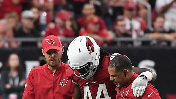 GLENDALE, AZ - OCTOBER 01: Outside linebacker Markus Golden #44 of the Arizona Cardinals is helped off the field during the second half of the NFL game against the San Francisco 49ers at the University of Phoenix Stadium on October 1, 2017 in Glendale, Arizona. (Photo by Norm Hall/Getty Images)