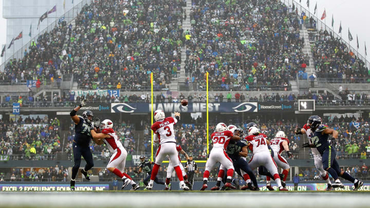 SEATTLE – DECEMBER 22: Carson PalmerSEATTLE – DECEMBER 22: Carson Palmer #3 of the Arizona Cardinals throws a pass against the Seattle Seahawks on December 22, 2013, at CenturyLink Field in Seattle, Washington. (Photo by Jonathan Ferrey/Getty Images)