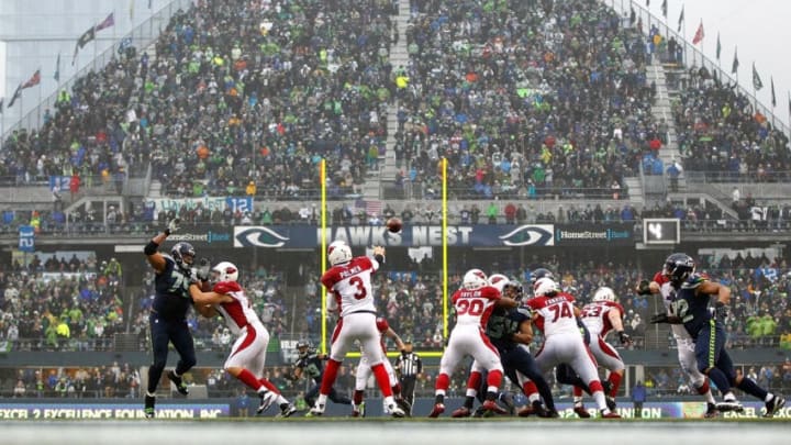 SEATTLE - DECEMBER 22: Carson PalmerSEATTLE - DECEMBER 22: Carson Palmer #3 of the Arizona Cardinals throws a pass against the Seattle Seahawks on December 22, 2013 at CenturyLink Field in Seattle, Washington. (Photo by Jonathan Ferrey/Getty Images)