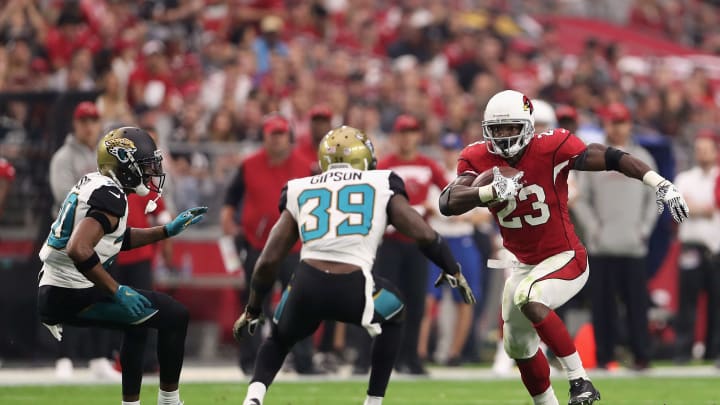 GLENDALE, AZ – NOVEMBER 26: Running back Adrian Peterson #23 of the Arizona Cardinals rushes the football against cornerback Jalen Ramsey #20 and free safety Tashaun Gipson #39 of the Jacksonville Jaguars during the first half of the NFL game at the University of Phoenix Stadium on November 26, 2017 in Glendale, Arizona. The Cardinals defeated the Jaguars 27-24. (Photo by Christian Petersen/Getty Images)