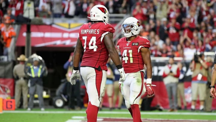 GLENDALE, ARIZONA - DECEMBER 15: Running back Kenyan Drake #41 of the Arizona Cardinals reacts with offensive tackle D.J. Humphries #74 after scoring a 17 yard rushing touchdown against the Cleveland Browns during the second half of the NFL game at State Farm Stadium on December 15, 2019 in Glendale, Arizona. The Cardinals defeated the Browns 38-24. (Photo by Christian Petersen/Getty Images)