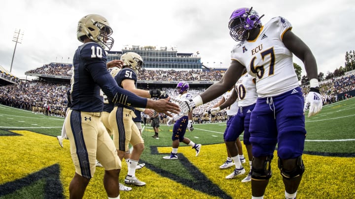 ANNAPOLIS, MD – SEPTEMBER 14: Malcolm Perry #10 of the Navy Midshipmen shakes hands with D’Ante Smith #67 of the East Carolina Pirates ahead of a game at Navy-Marine Corps Stadium on September 14, 2019, in Annapolis, Maryland (Photo by Benjamin Solomon/Getty Images)