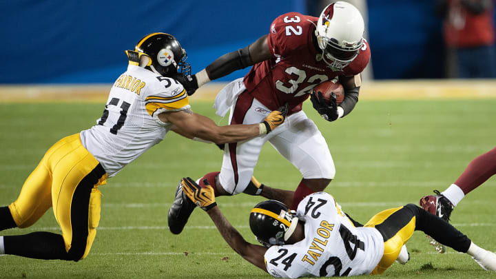 TAMPA, FL – FEBRUARY 1: Edgerrin James #32 of the Arizona Cardinal gets tackled by James Farrior #51 and Ike Taylor #24 of the Pittsburgh Steeler in Super Bowl XLIII on February 1, 2009 at Raymond James Stadium in Tampa, Florida. The Steelers won the game 27-23. (Photo by Focus on Sport/Getty Images))