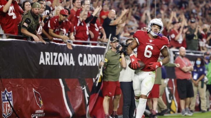Nov 14, 2021; Glendale, Arizona, USA; Arizona Cardinals running back James Conner (6) runs the ball in for a touchdown during the second half against the Carolina Panthers at State Farm Stadium. Mandatory Credit: Douglas DeFelice-USA TODAY Sports