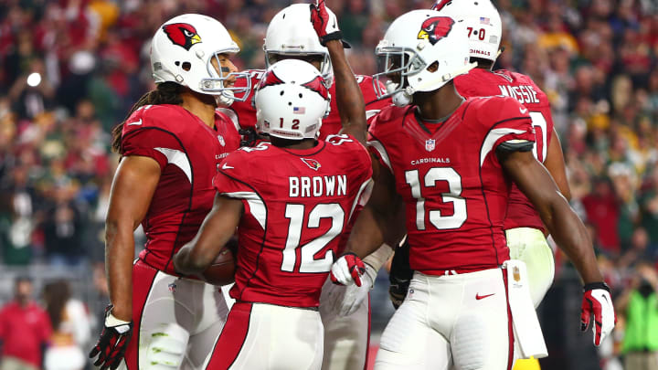 Dec 27, 2015; Glendale, AZ, USA; Arizona Cardinals wide receiver John Brown (12) celebrates with teammates Larry Fitzgerald (11) and Jaron Brown (13) after scoring a touchdown in the second quarter against the Green Bay Packers at University of Phoenix Stadium. Mandatory Credit: Mark J. Rebilas-USA TODAY Sports