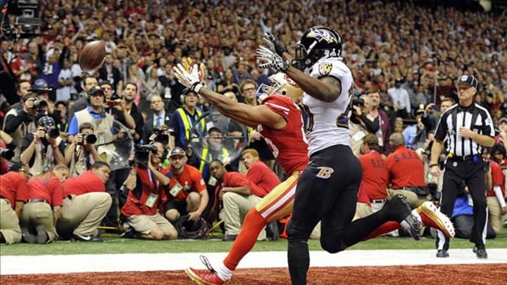 Feb 3, 2013; New Orleans, LA, USA; San Francisco 49ers wide receiver Michael Crabtree (rear) is unable to catch a pass on fourth down against Baltimore Ravens free safety Ed Reed (20) in the fourth quarter in Super Bowl XLVII at the Mercedes-Benz Superdome. Mandatory Credit: Robert Deutsch-USA TODAY Sports