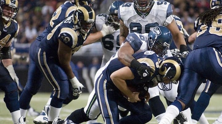 November 20, 2011; St. Louis, MO, USA; Seattle Seahawks outside linebacker Leroy Hill (56) sacks St. Louis Rams quarterback Sam Bradford (8) in the second half at the Edward Jones Dome. Seattle defeated St. Louis 24-7. Mandatory Credit: Jeff Curry-USA TODAY Sports