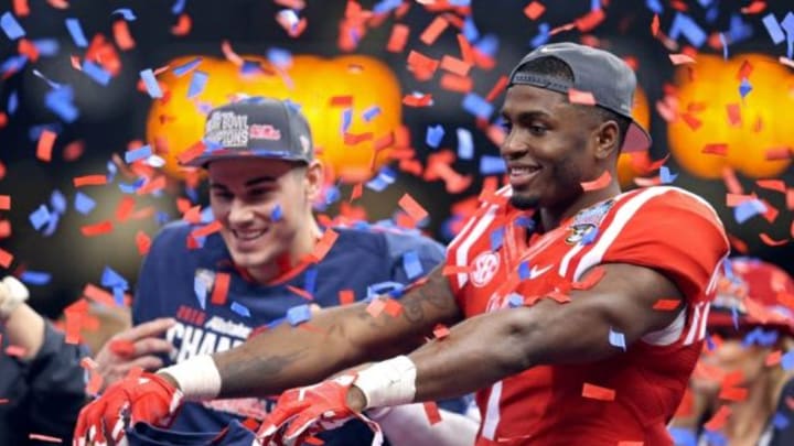 Jan 1, 2016; New Orleans, LA, USA; Mississippi Rebels quarterback Chad Kelly and wide receiver Laquon Treadwell (1) celebrate at the end of the 2016 Sugar Bowl at the Mercedes-Benz Superdome. Mississippi defeated the Oklahoma State Cowboys, 48-20. Mandatory Credit: Chuck Cook-USA TODAY Sports