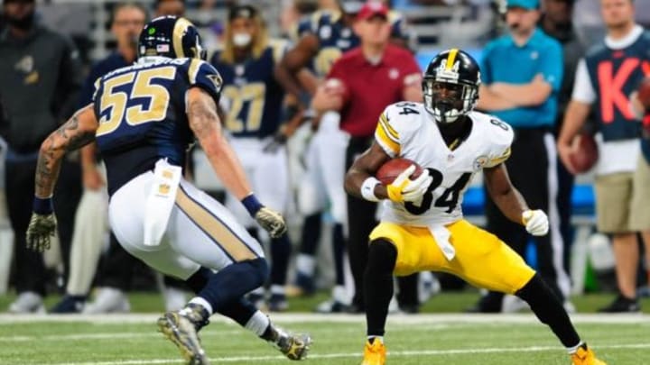 Sep 27, 2015; St. Louis, MO, USA; Pittsburgh Steelers wide receiver Antonio Brown (84) carries the ball away from St. Louis Rams middle linebacker James Laurinaitis (55) during the first half at The Edward Jones Dome. Mandatory Credit: Joshua Lindsey-USA TODAY Sports